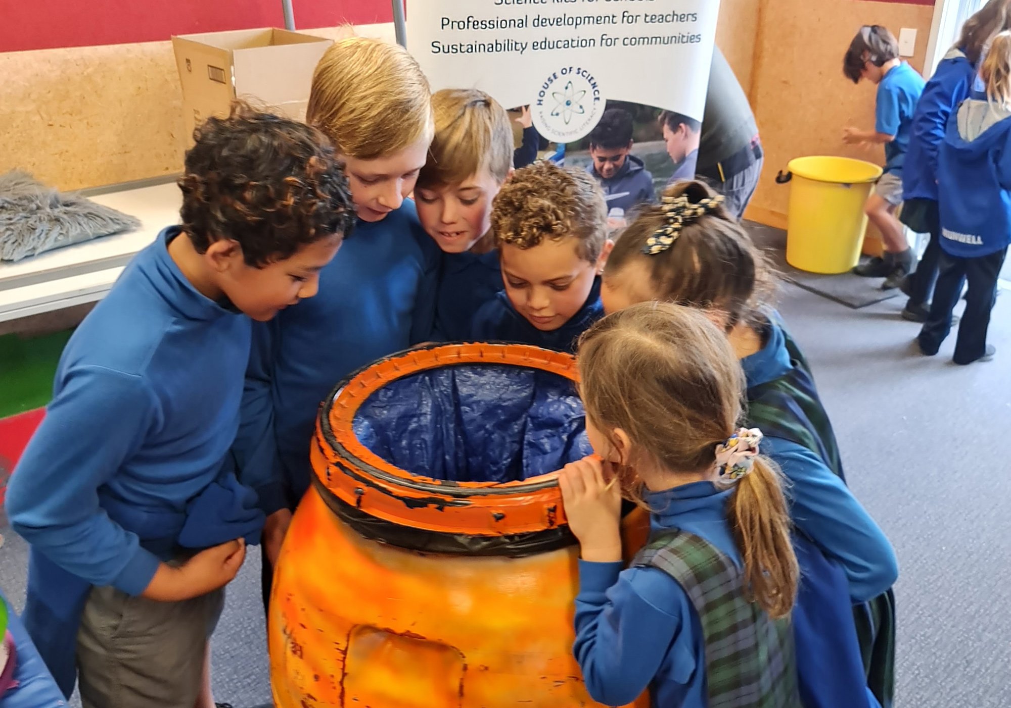 Kids peer into air cannon at science in schools assembly show